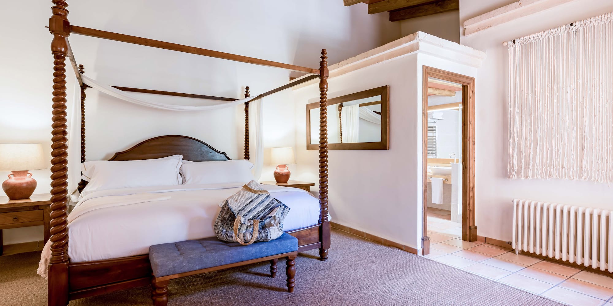 a bedroom with a four poster bed