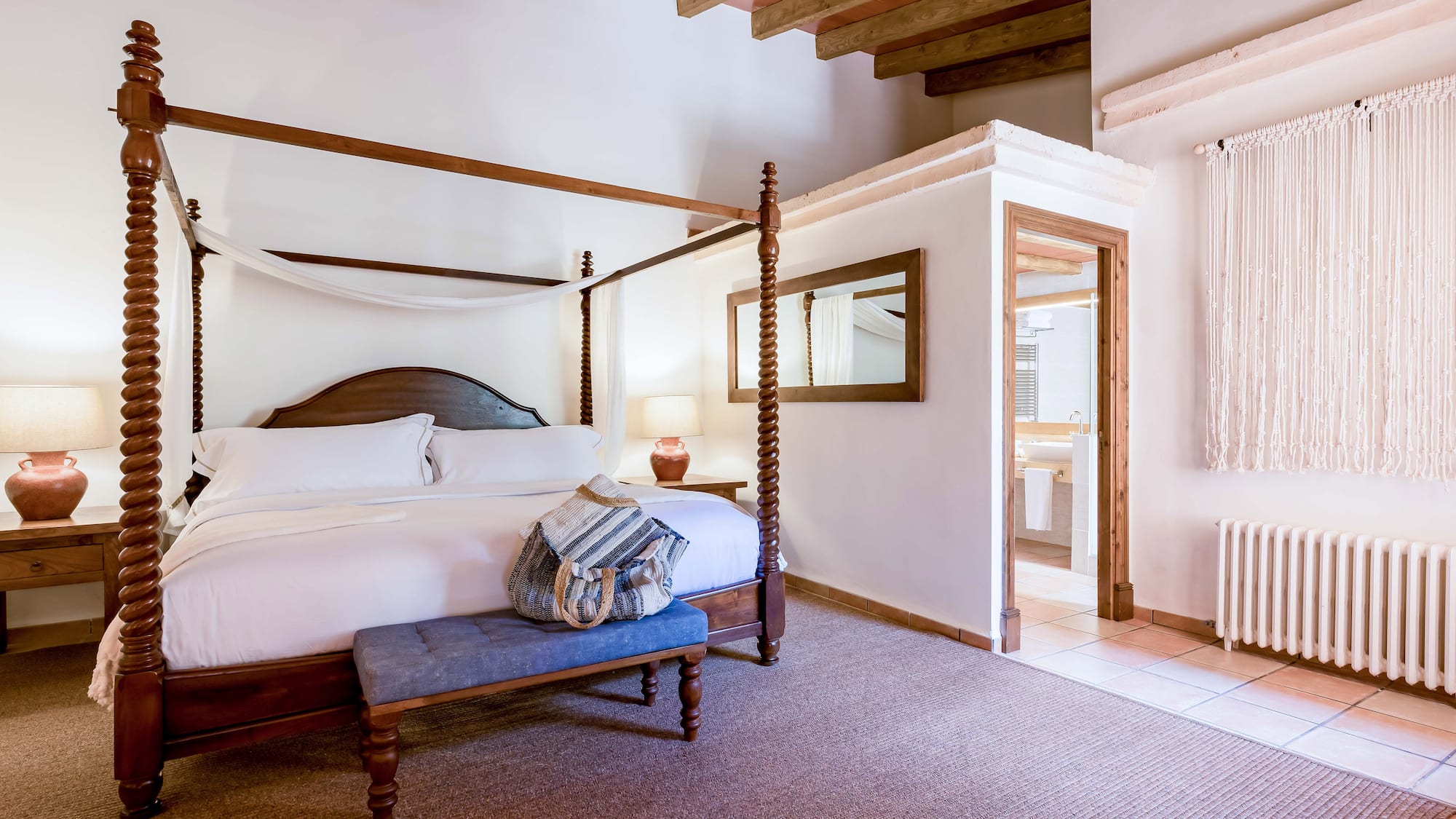 a bedroom with a four poster bed