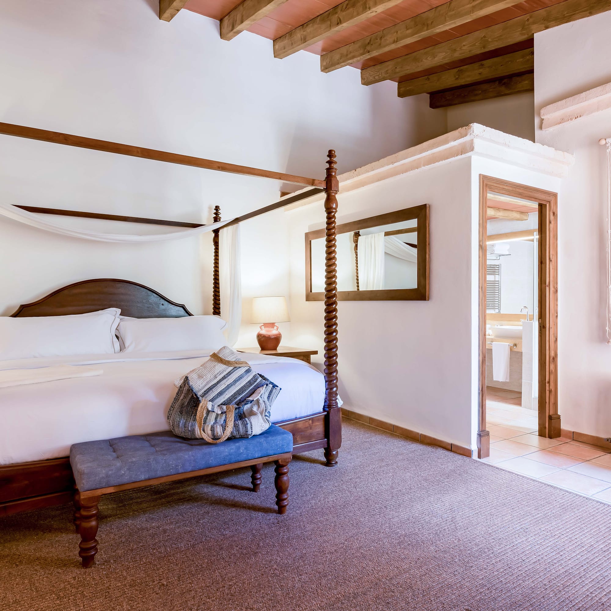 a bedroom with a four poster bed