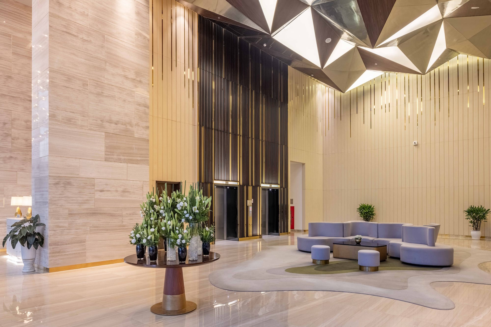 a lobby with a round table and chairs