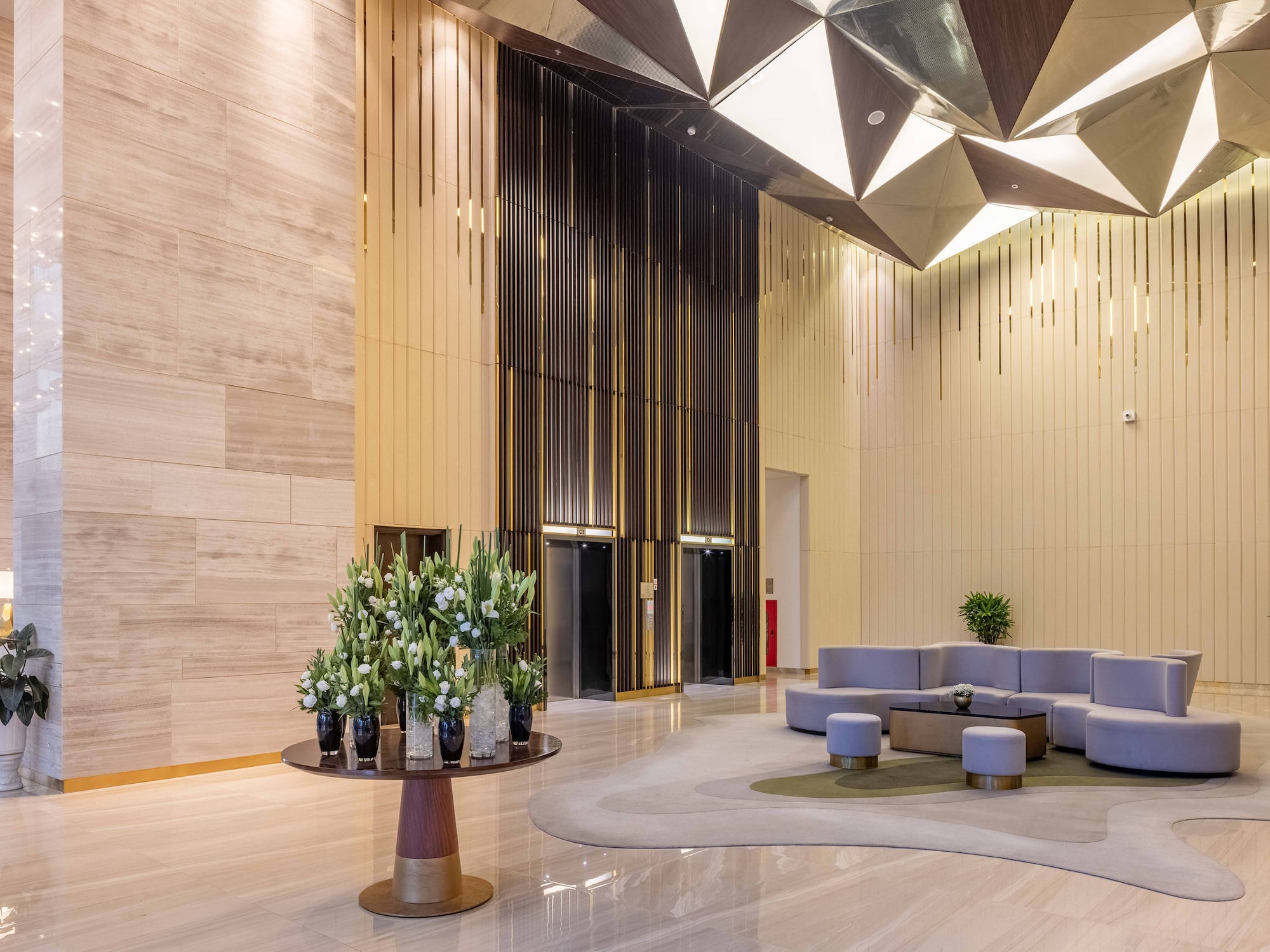a lobby with a round table and chairs