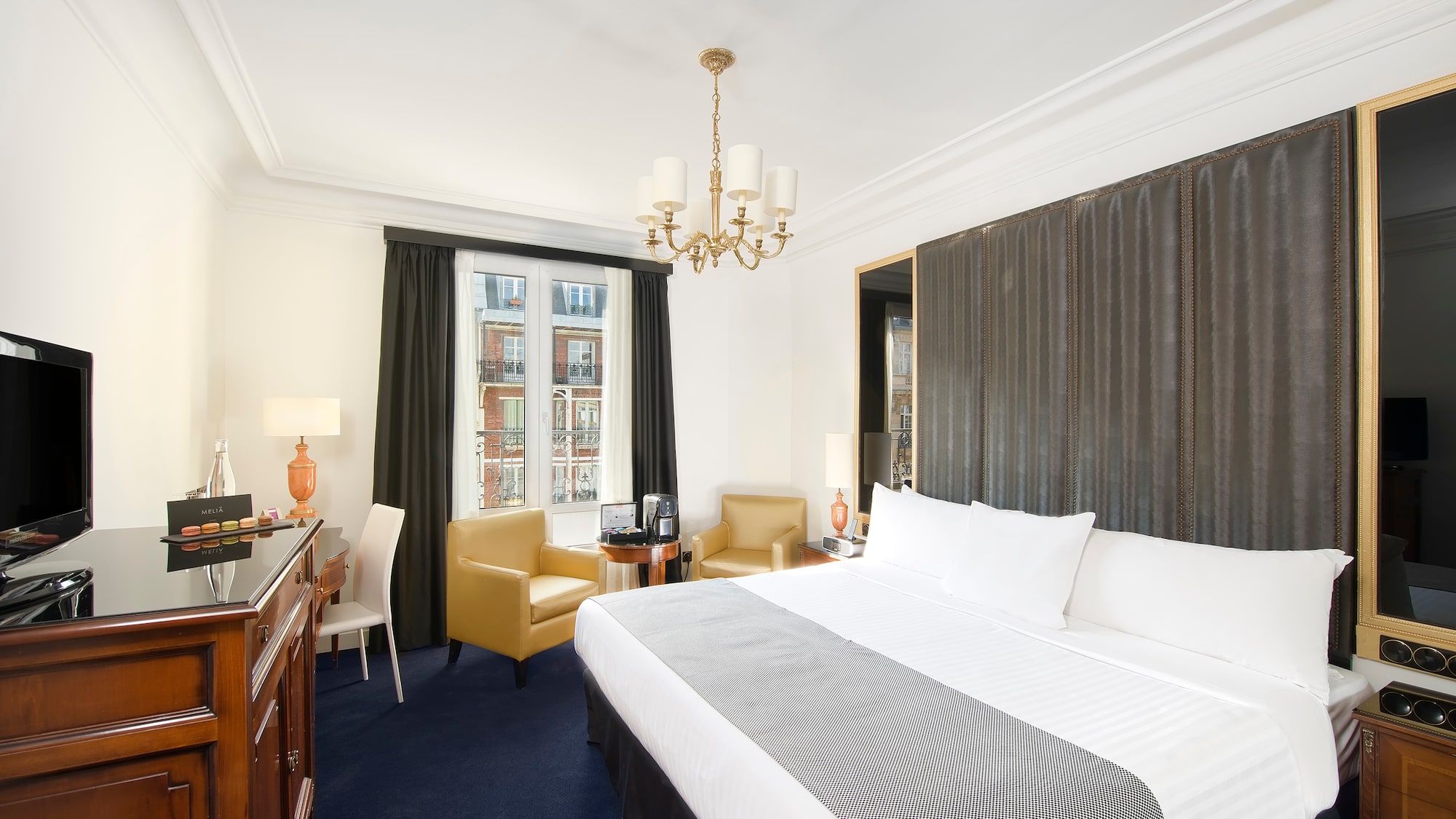 a room with a bed and a desk