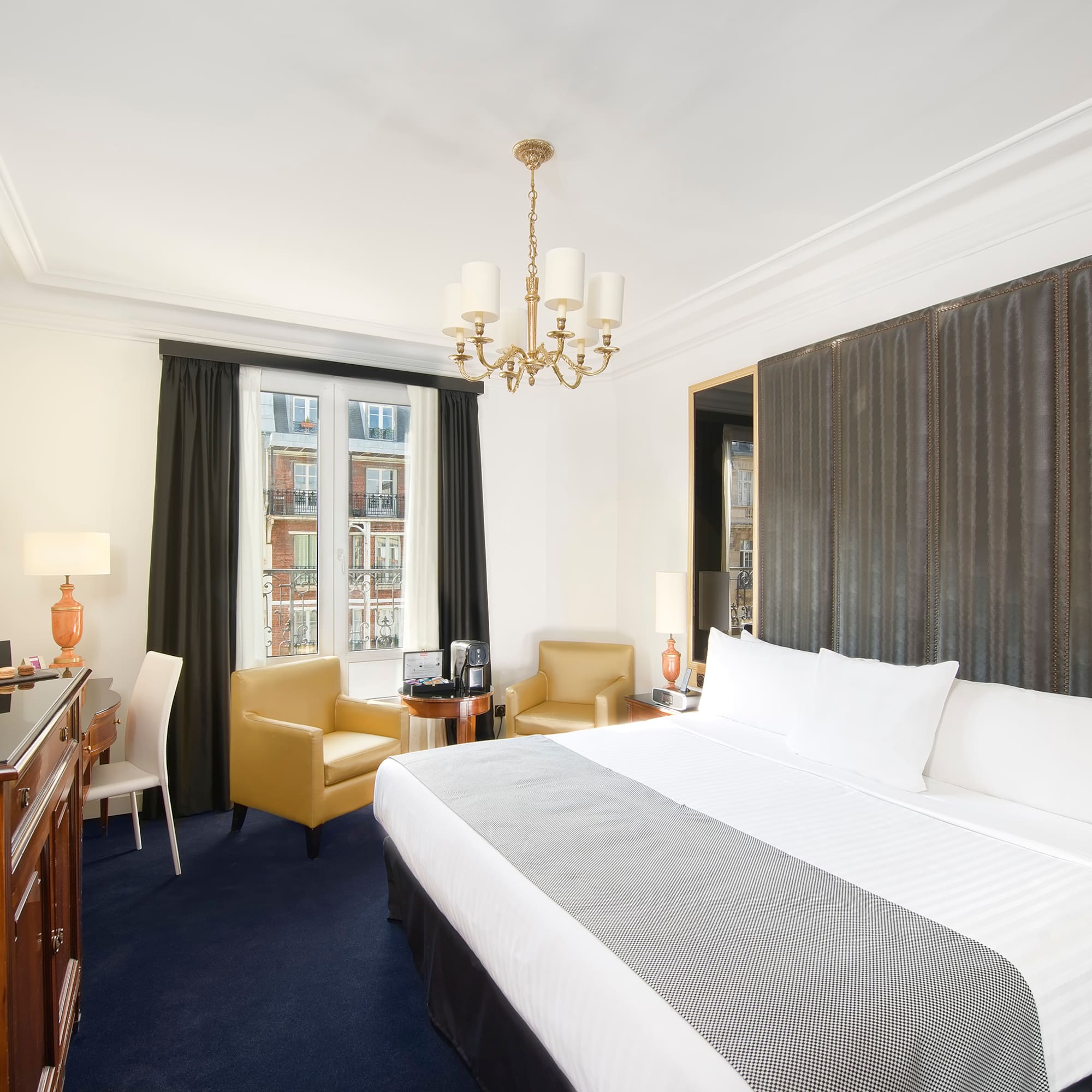 a room with a bed and a desk