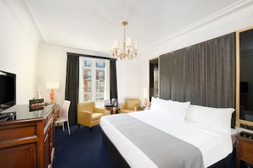 a room with a bed and a desk