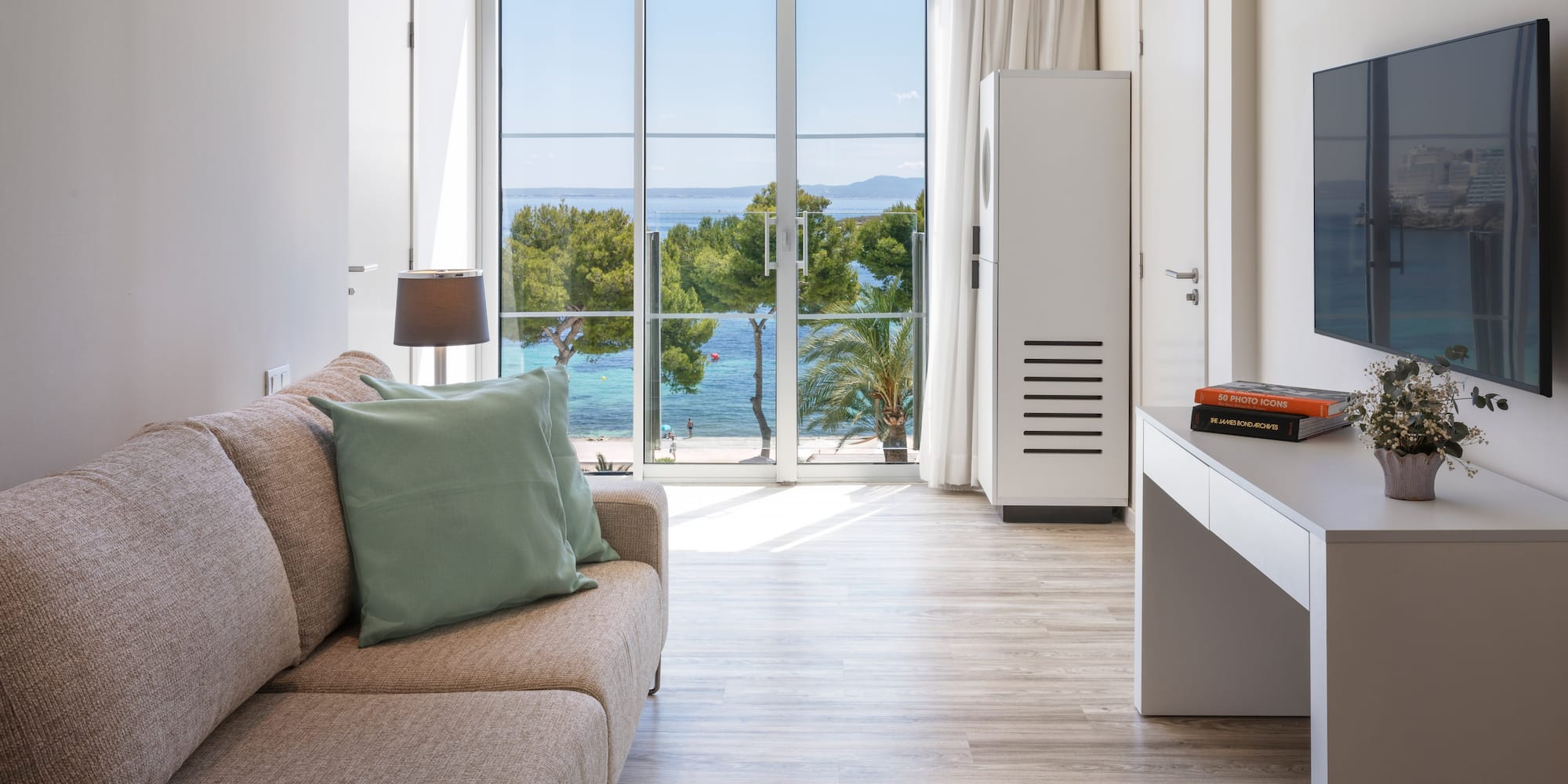 a living room with a couch and a desk