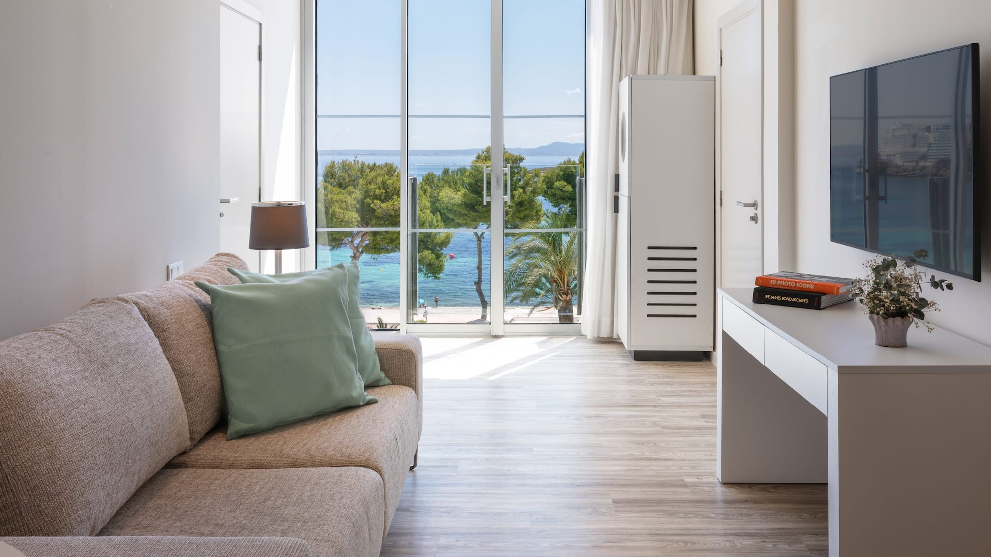 a living room with a couch and a desk