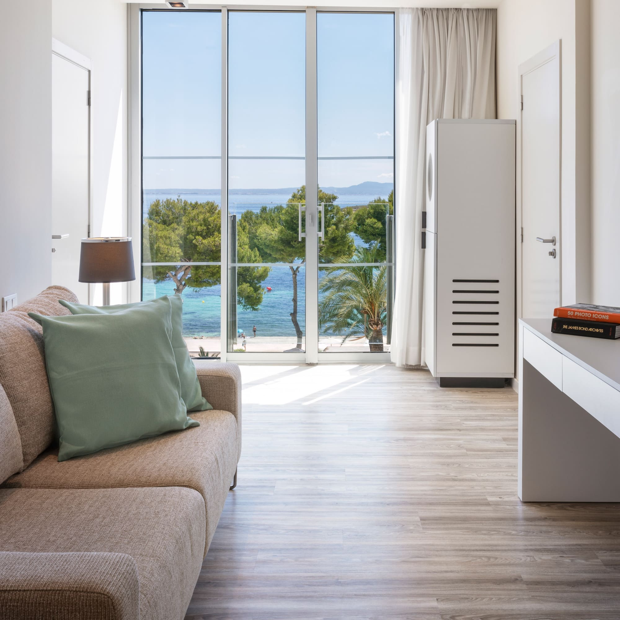 a living room with a couch and a desk