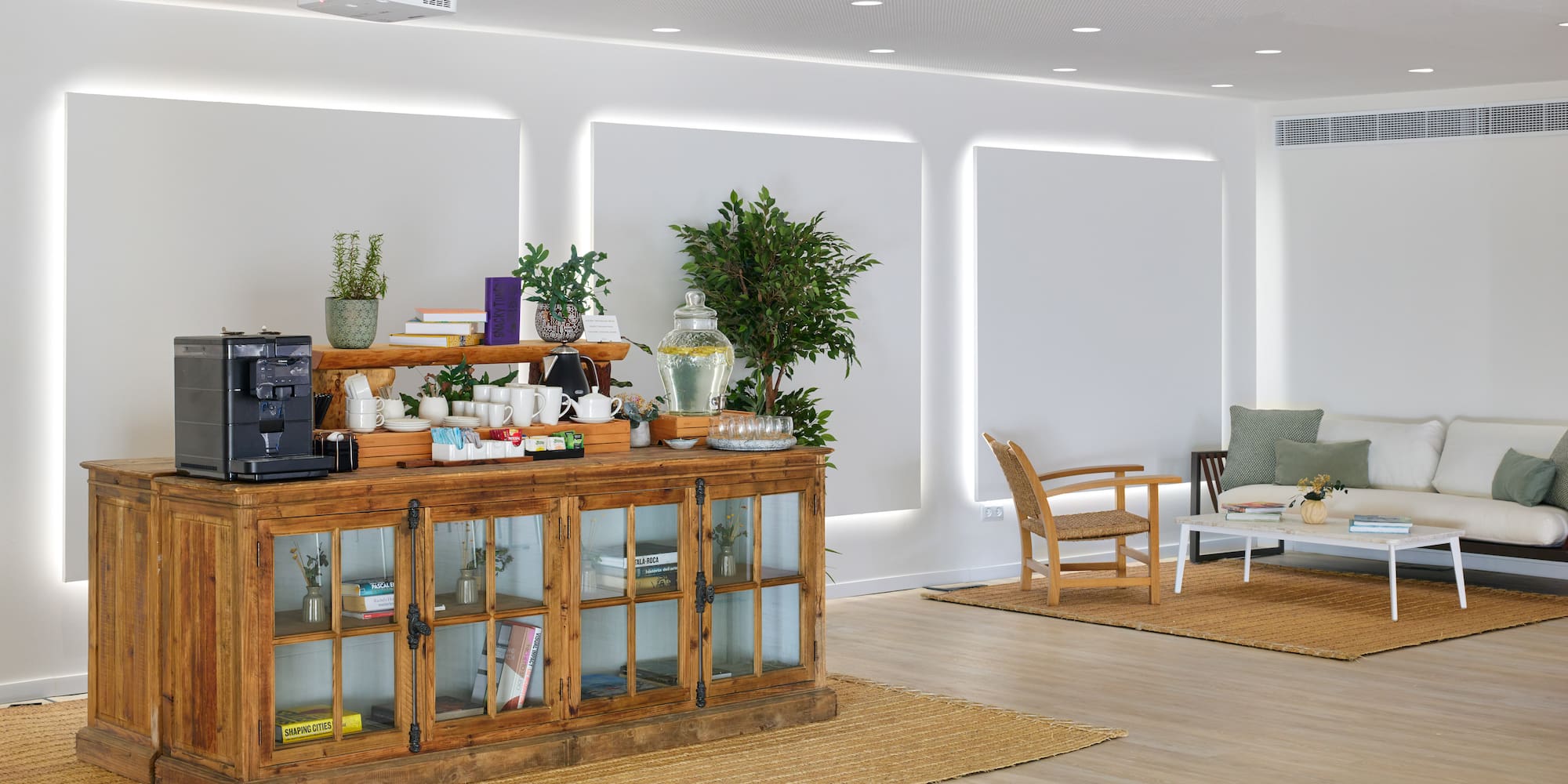 a room with a cabinet and a table and chairs