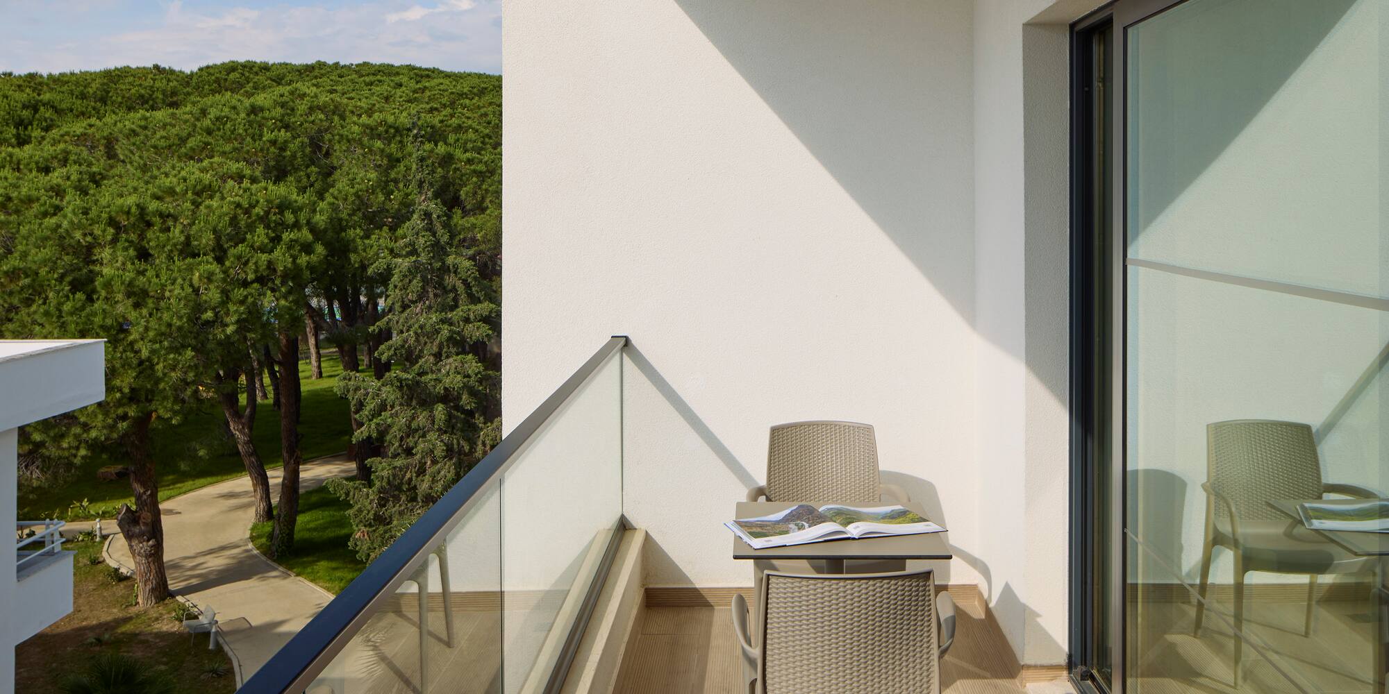 a chair and table on a balcony