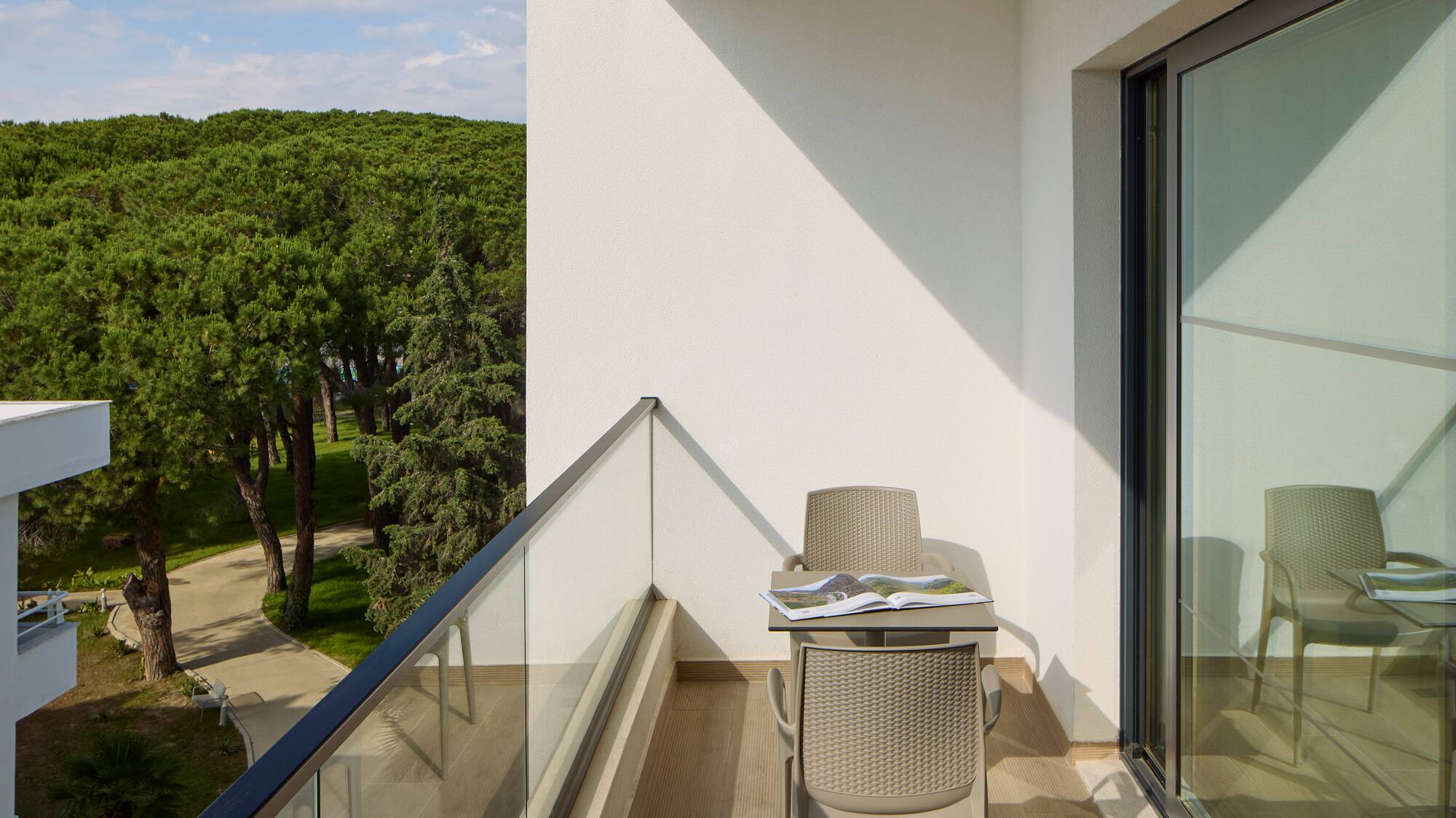 a chair and table on a balcony