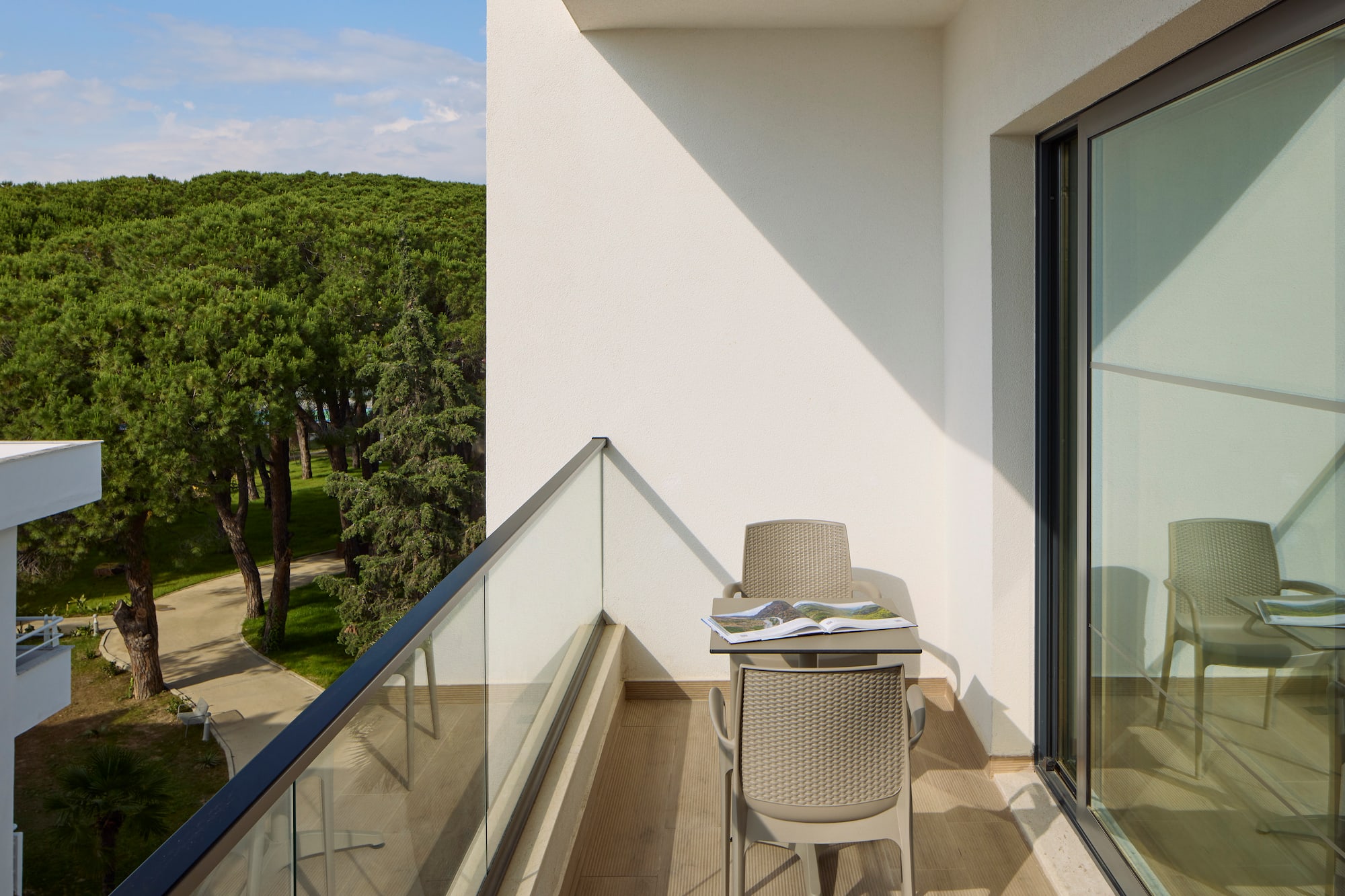 a chair and table on a balcony