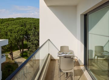 a chair and table on a balcony