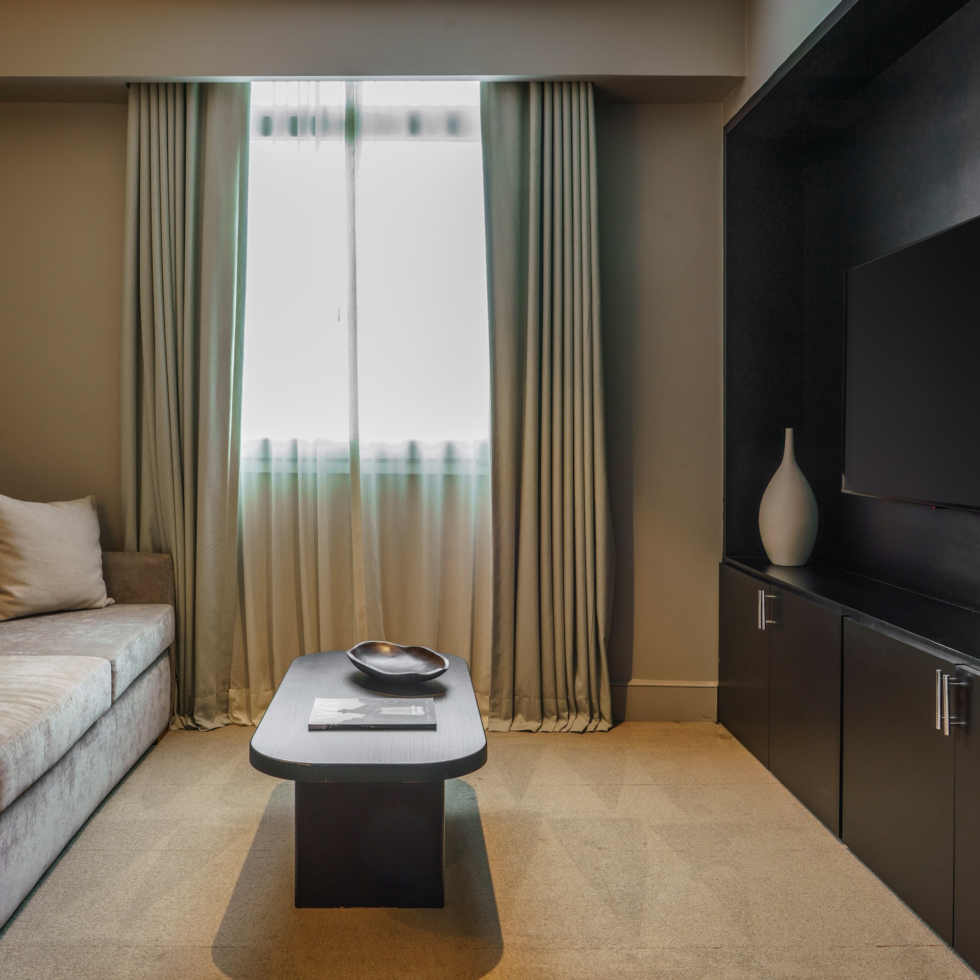 a living room with a couch and a tv