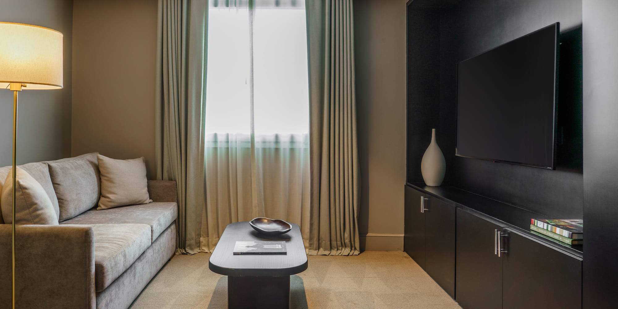 a living room with a couch and a tv