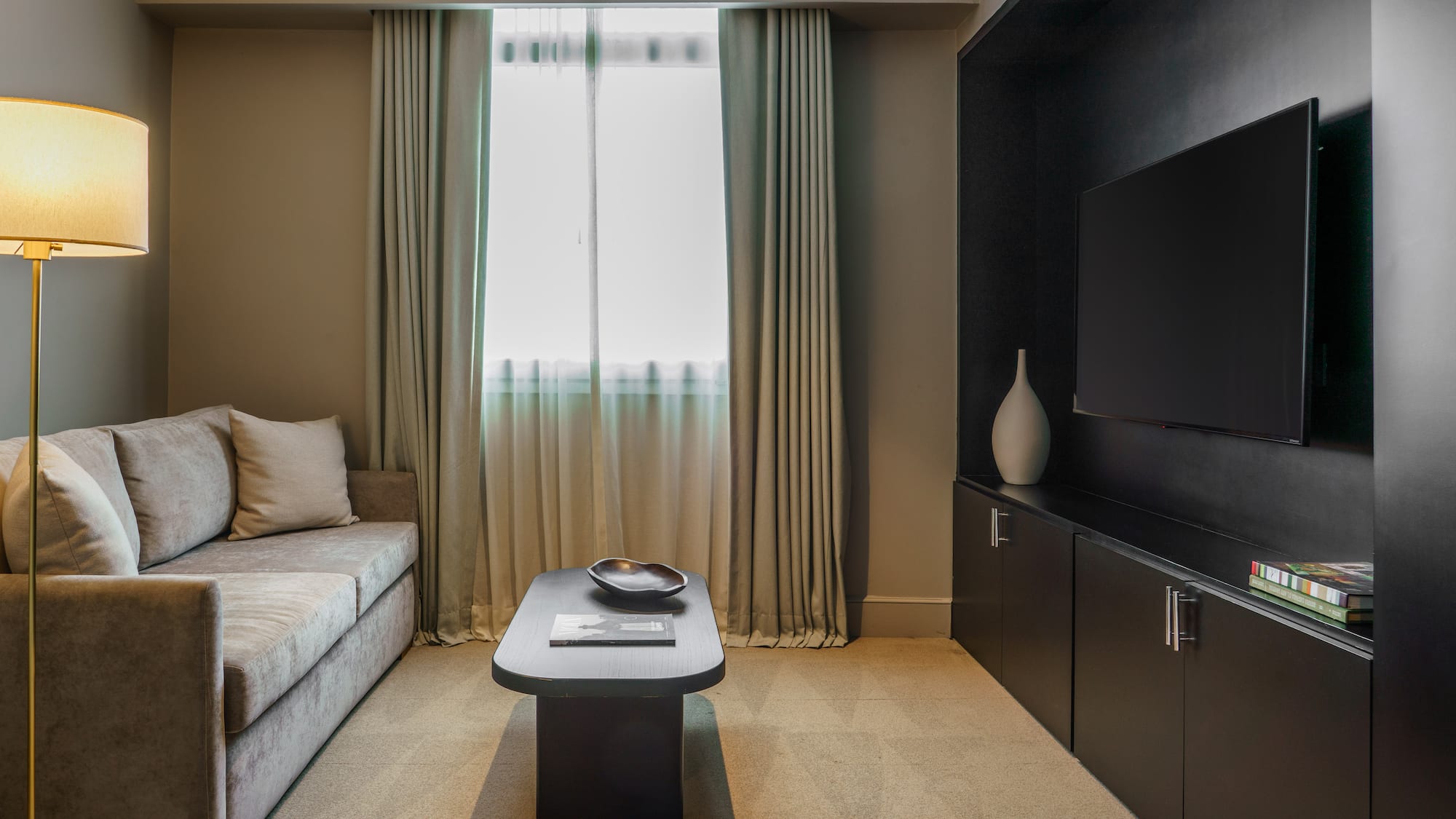 a living room with a couch and a tv