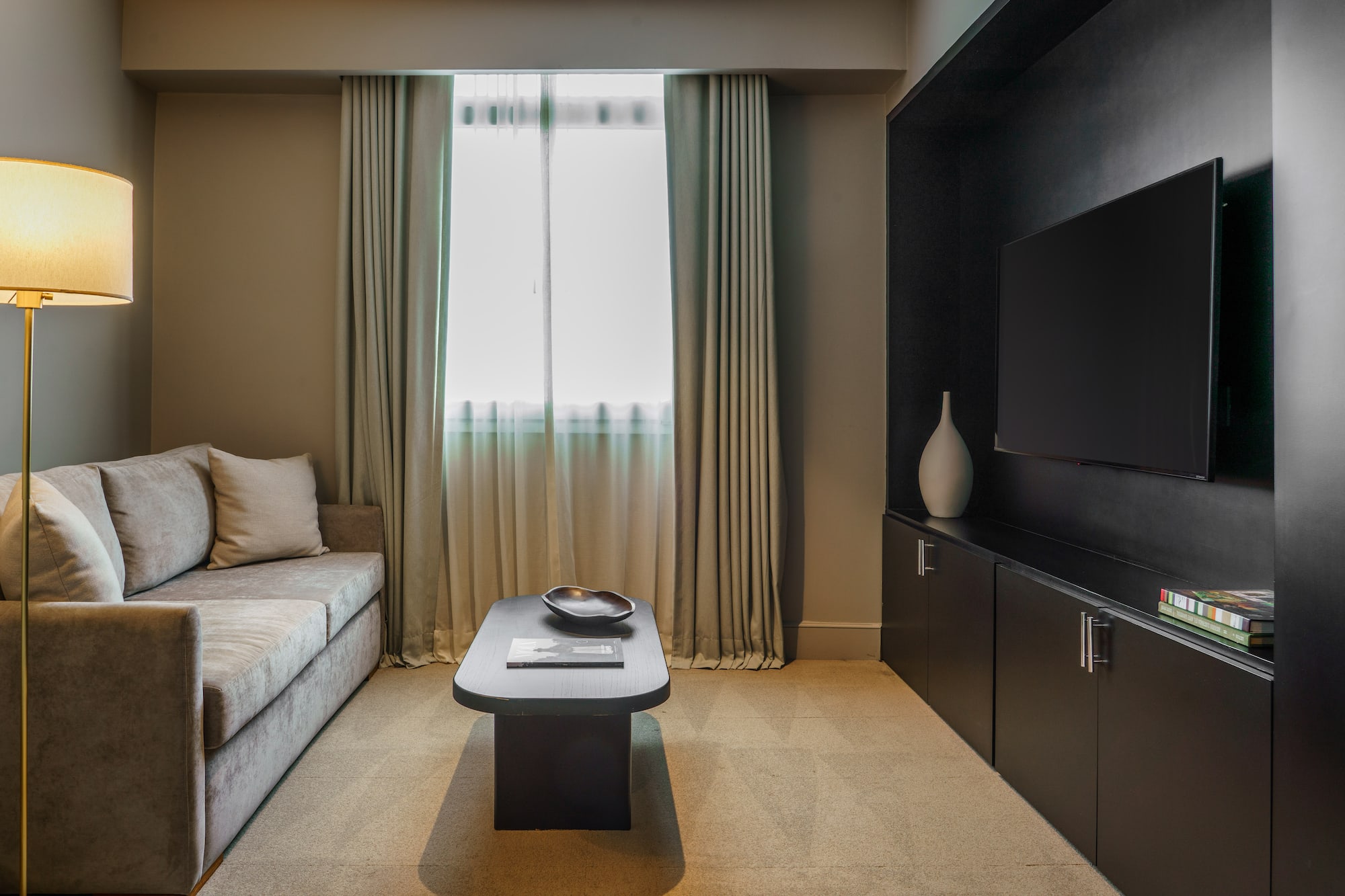 a living room with a couch and a tv