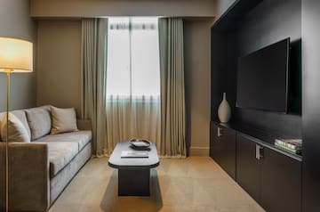 a living room with a couch and a tv