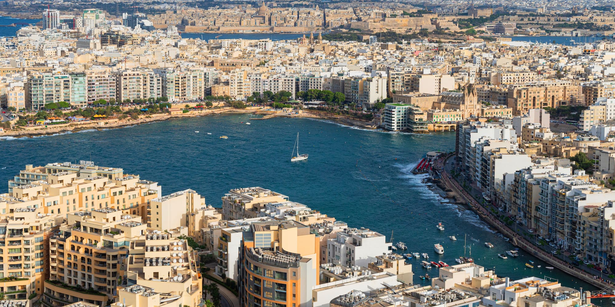 a city with many buildings and a body of water