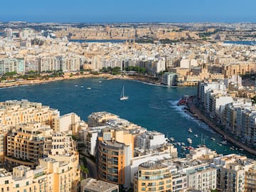 a city with many buildings and a body of water