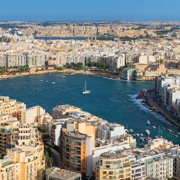 a city with many buildings and a body of water