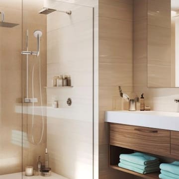 a bathroom with a glass shower door