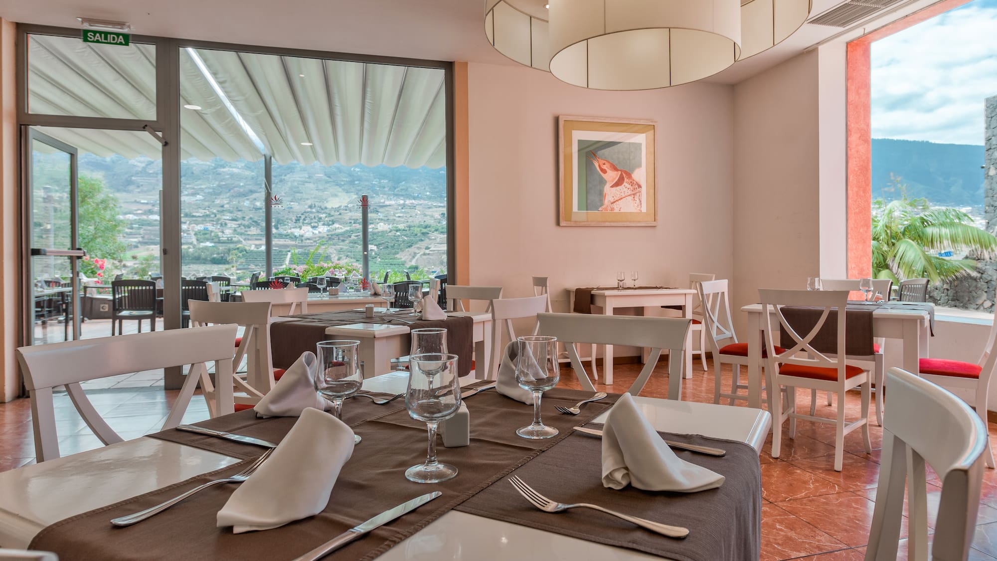 a restaurant with tables and chairs