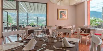 a restaurant with tables and chairs