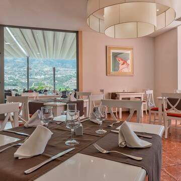a restaurant with tables and chairs