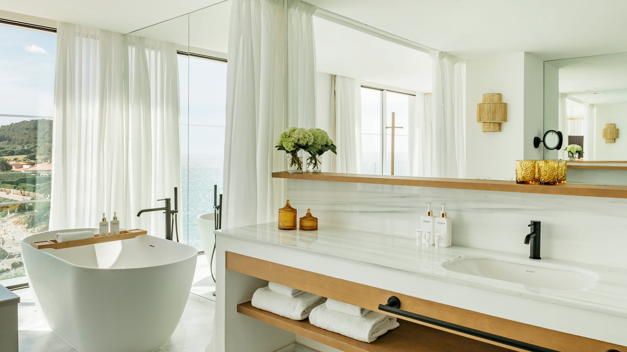 a bathroom with a tub and a bathtub
