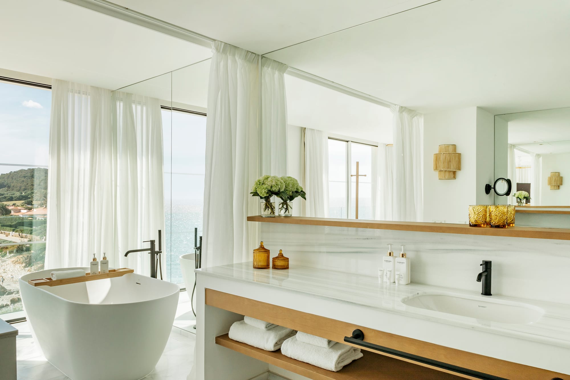 a bathroom with a tub and a bathtub