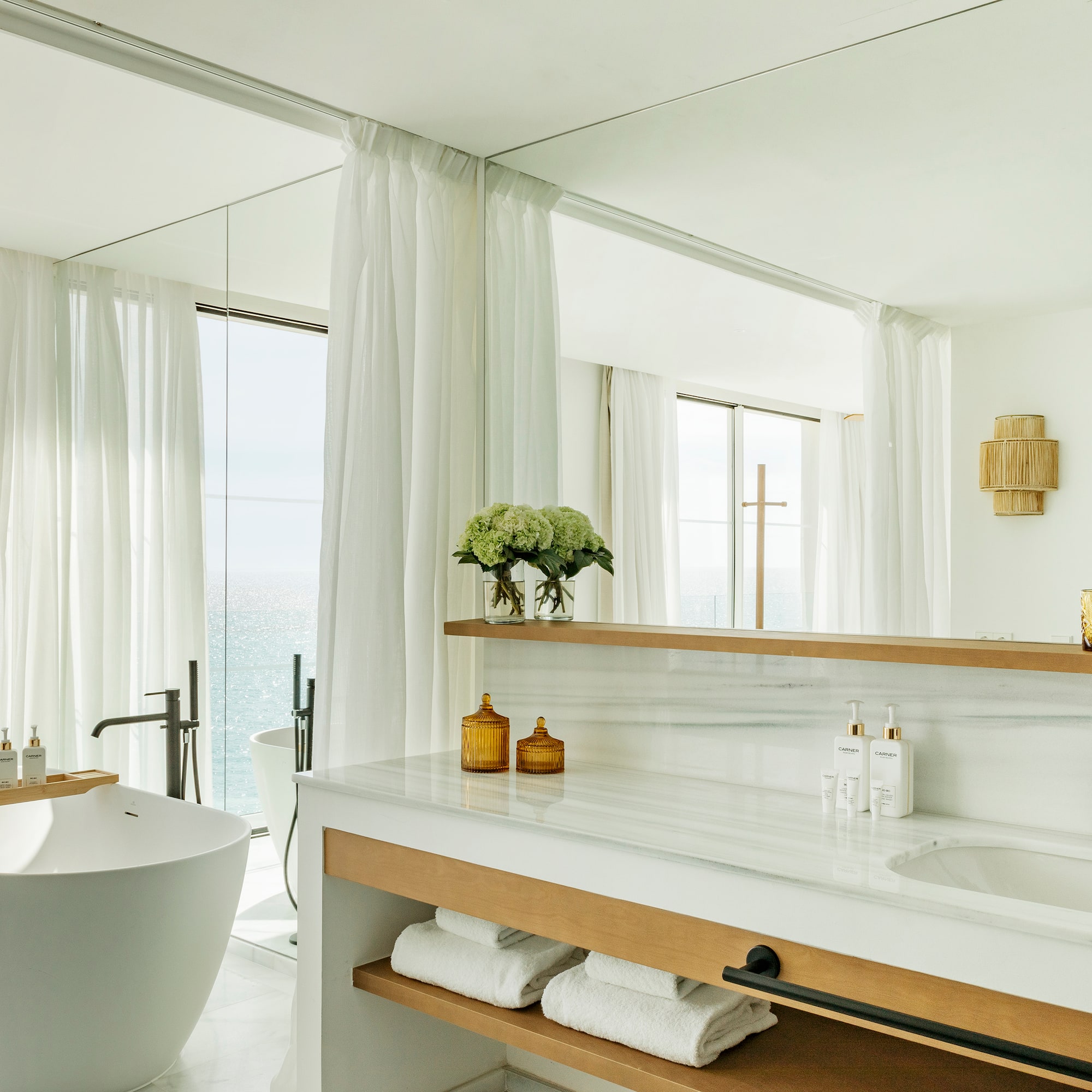 a bathroom with a tub and a bathtub