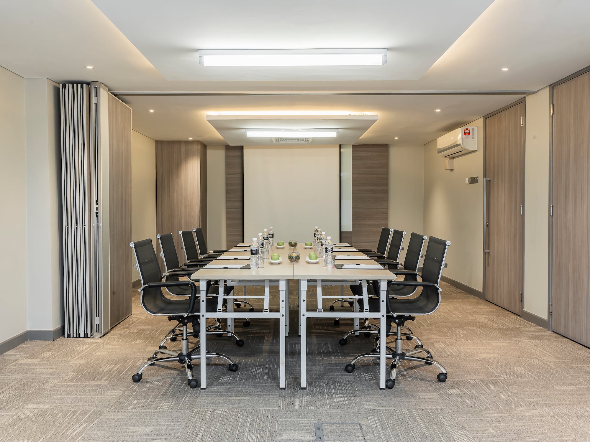 a conference room with a table and chairs