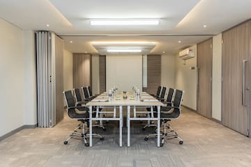 a conference room with a table and chairs