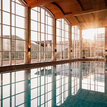 a large indoor pool with large windows
