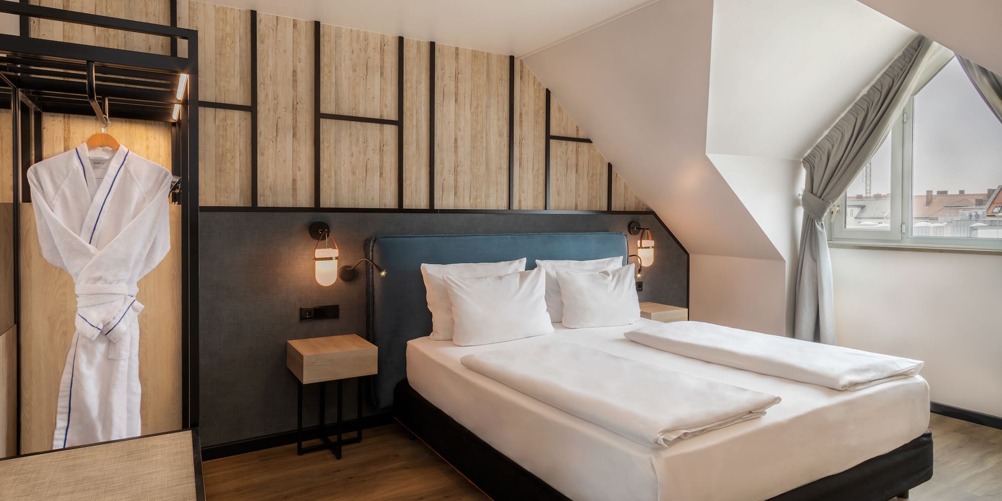 a bedroom with a bed and a window