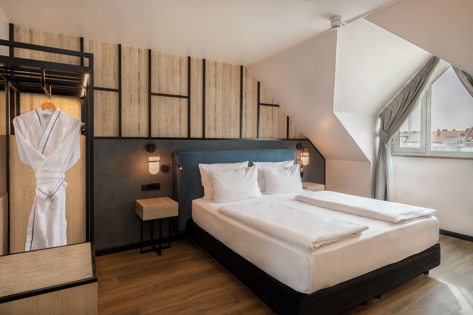 a bedroom with a bed and a window