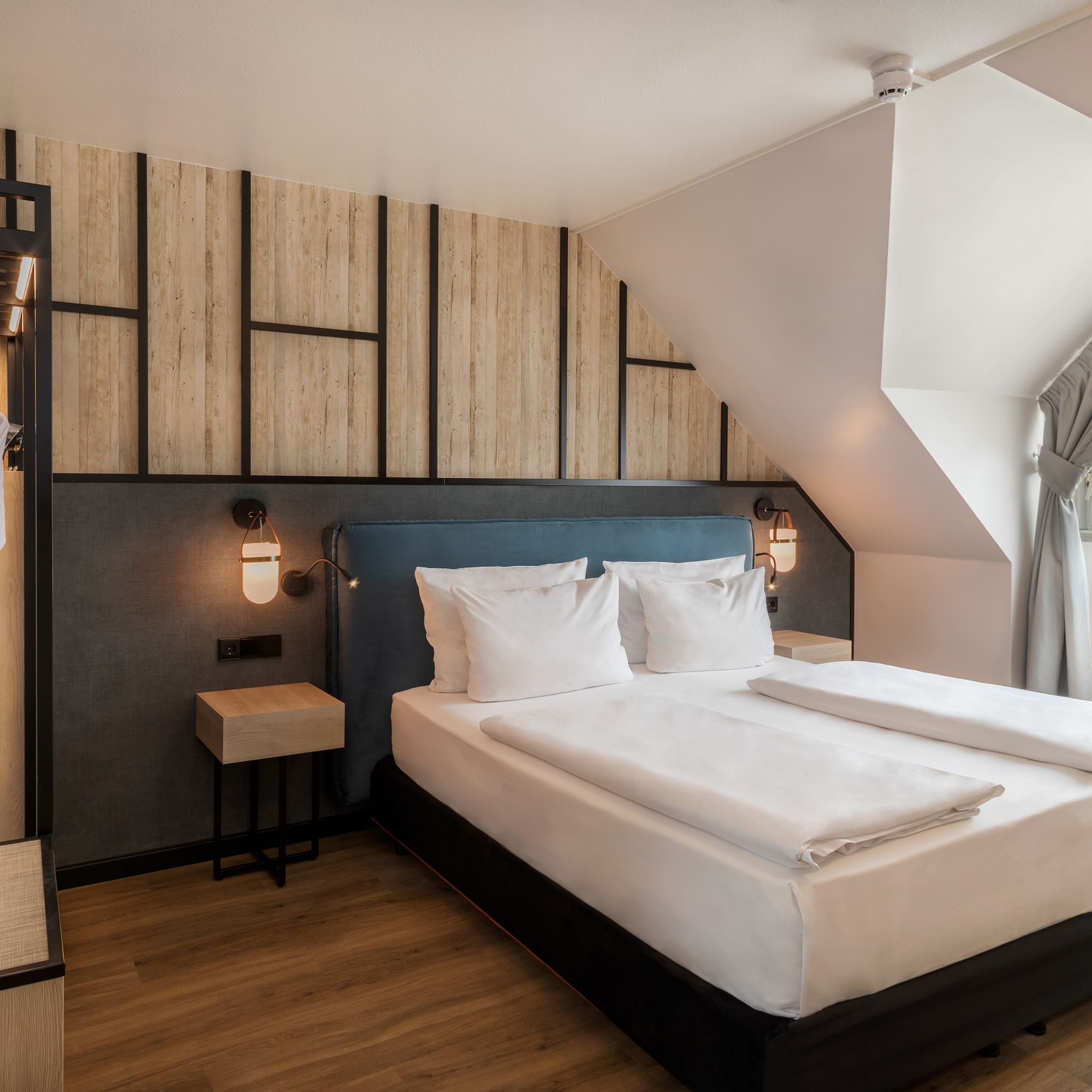 a bedroom with a bed and a window