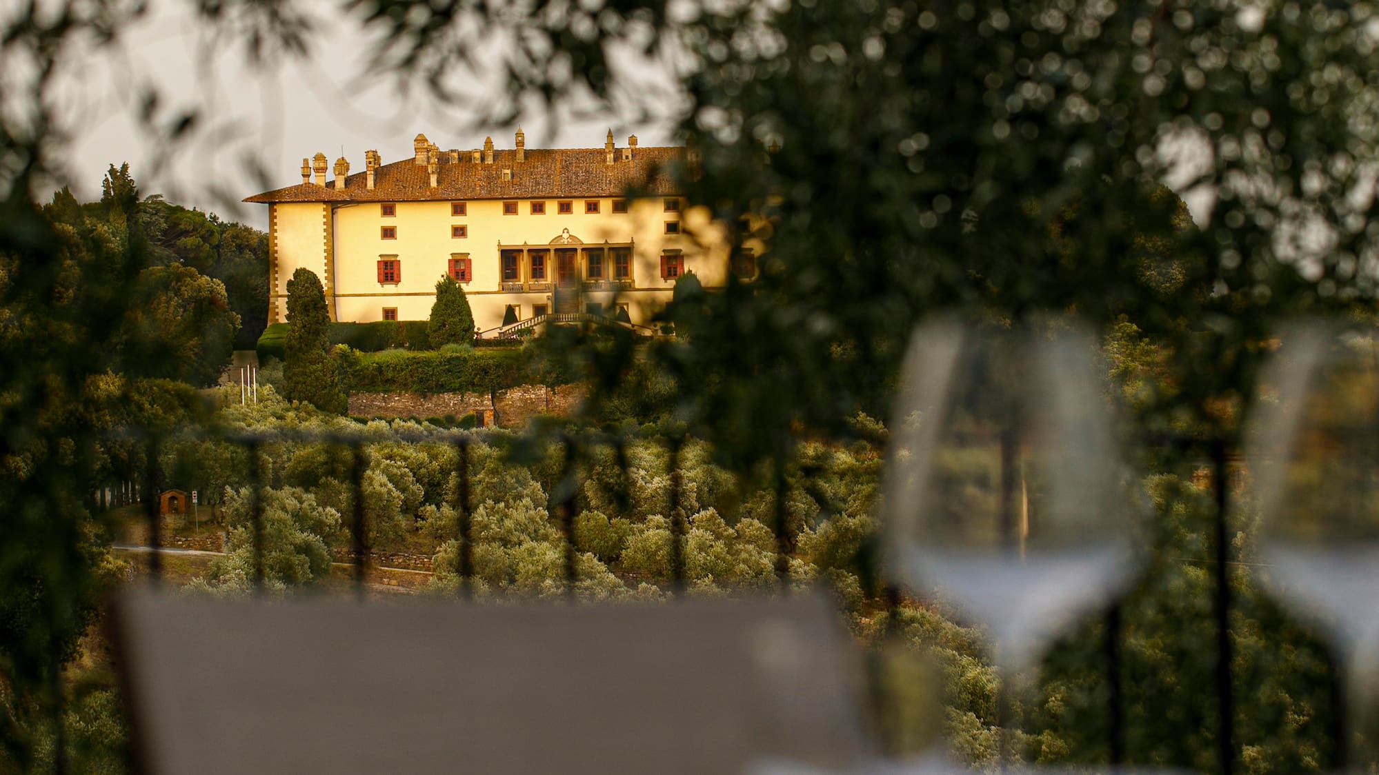 a table and chairs with a building in the background