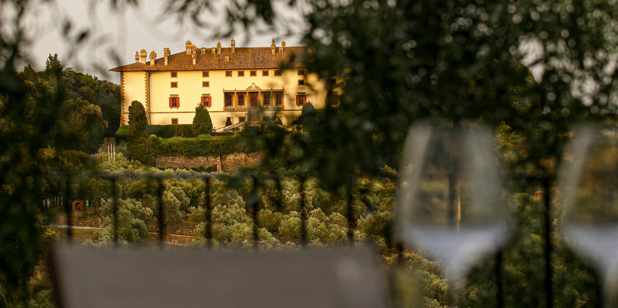 a table and chairs with a building in the background