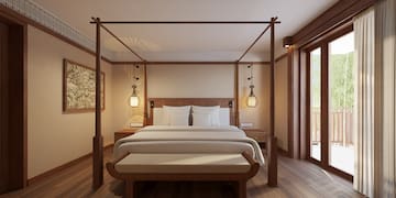 a bed with a four poster bed