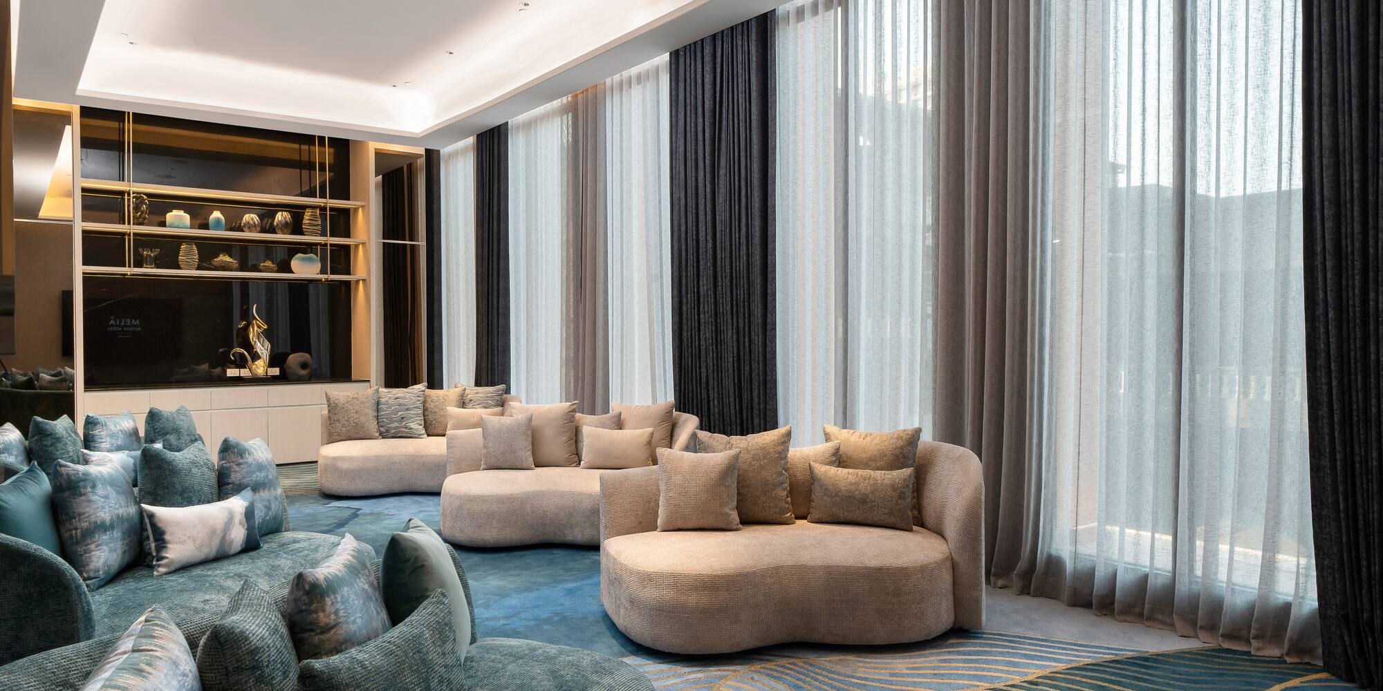 a room with couches and a shelf