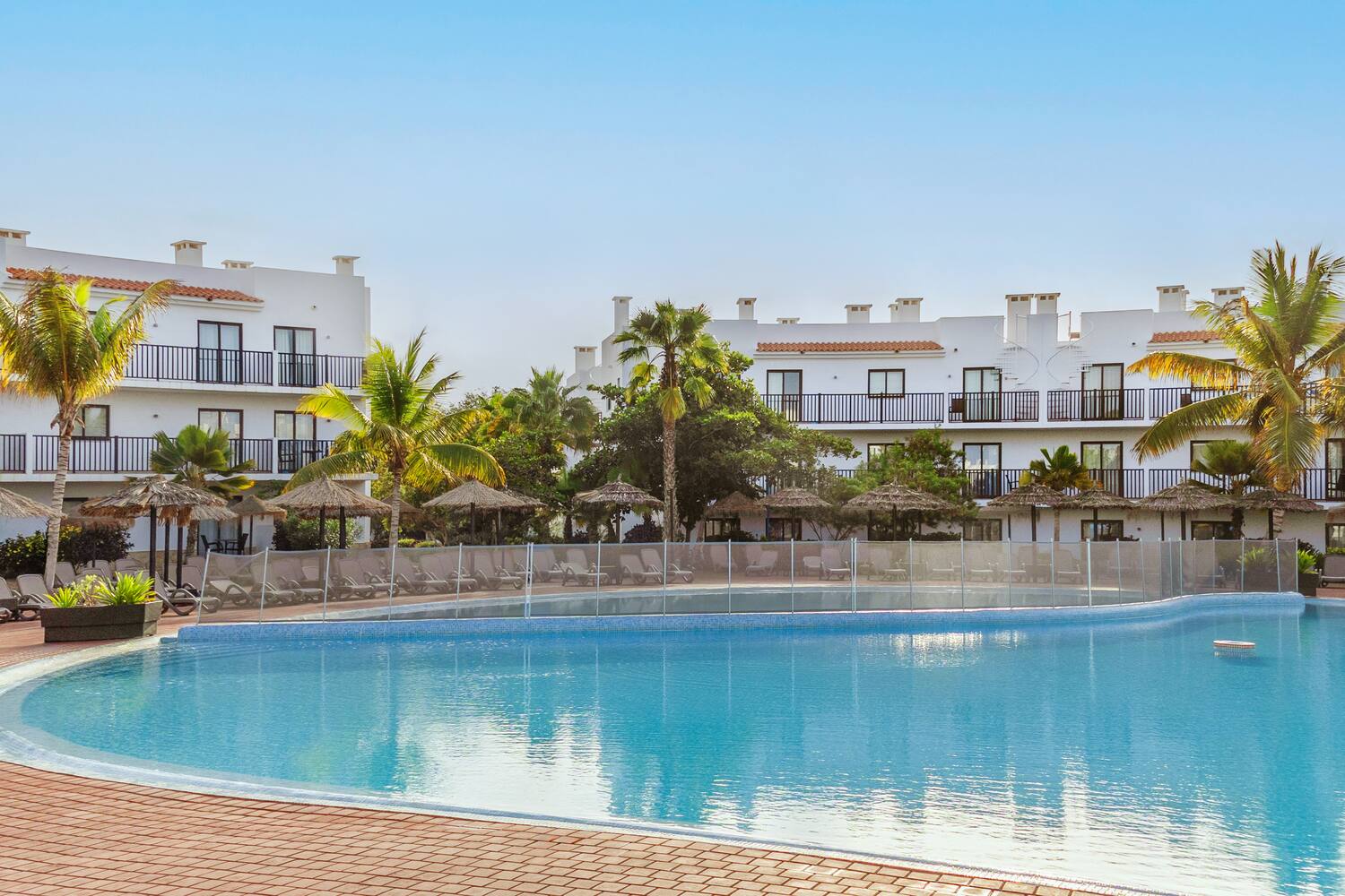 a pool with a building in the background