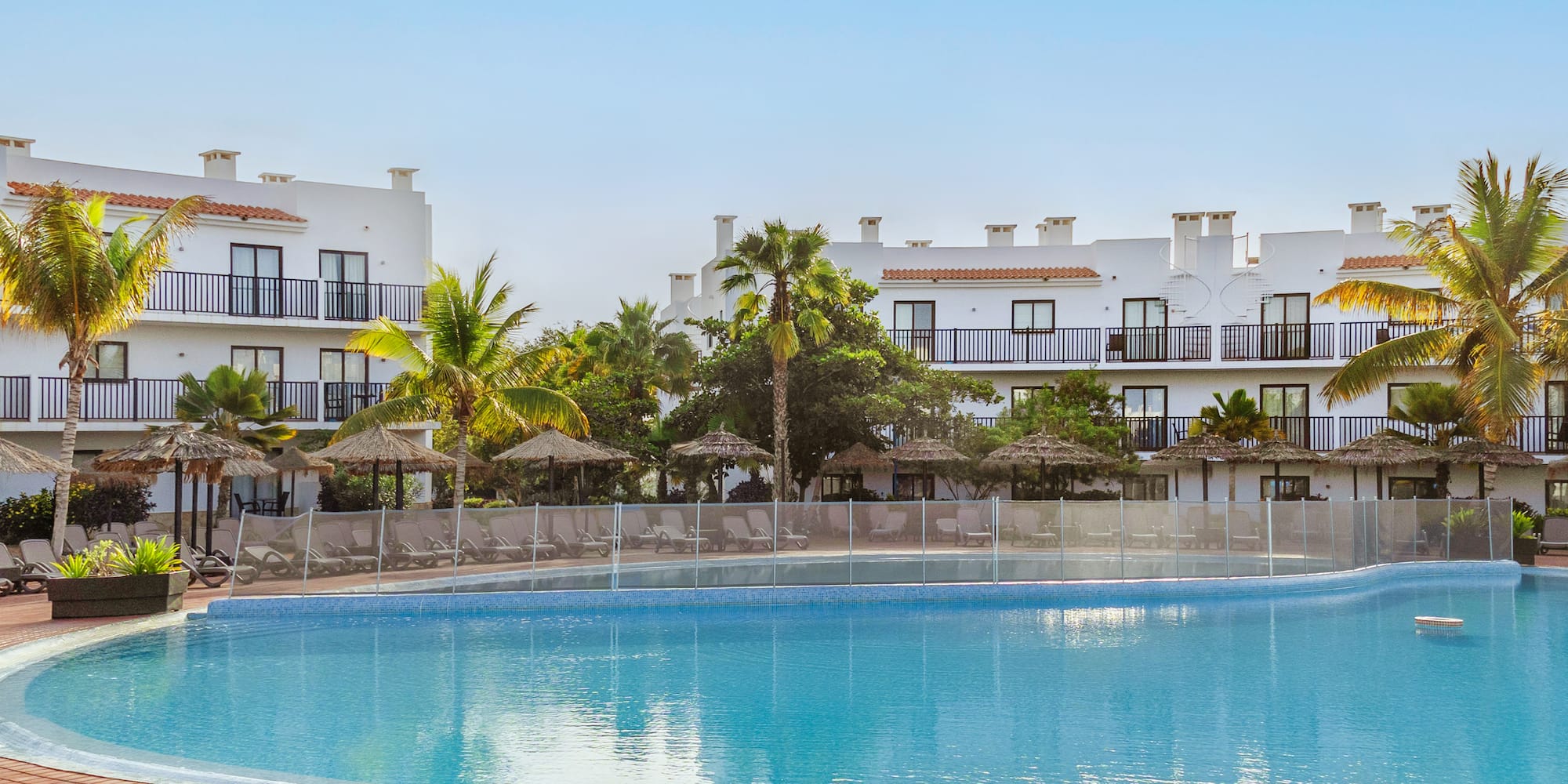 a pool with a building in the background