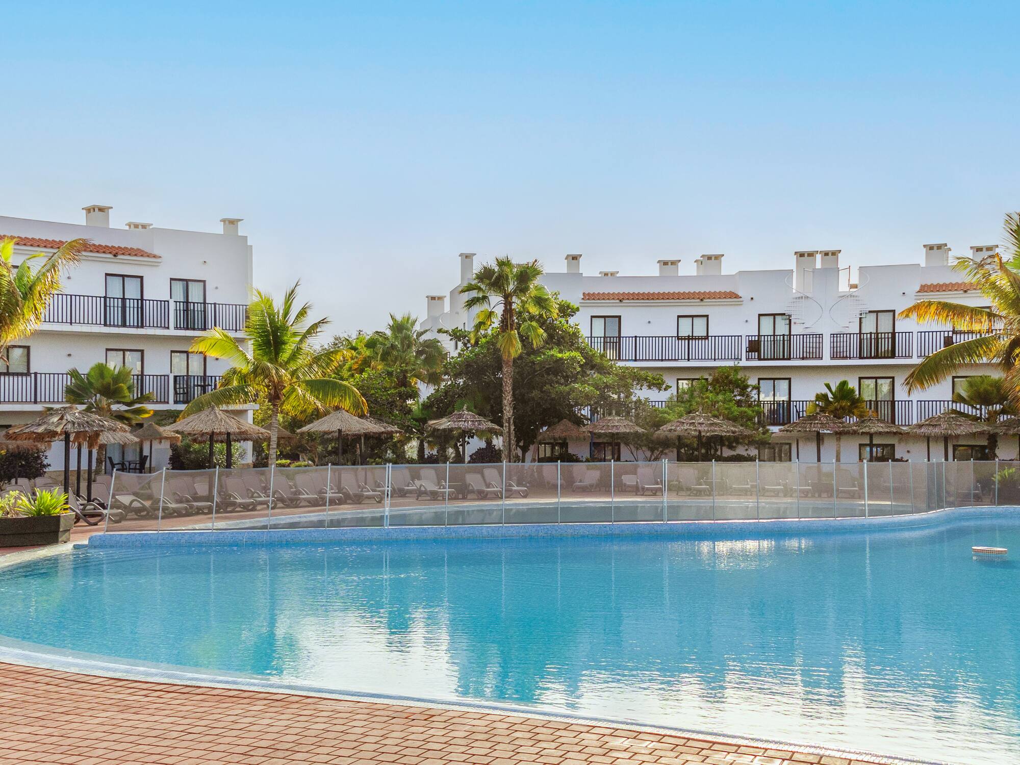 a pool with a building in the background