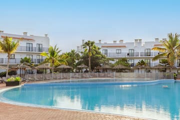 a pool with a building in the background