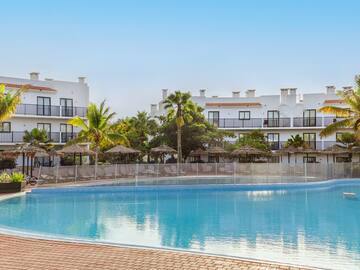 a pool with a building in the background