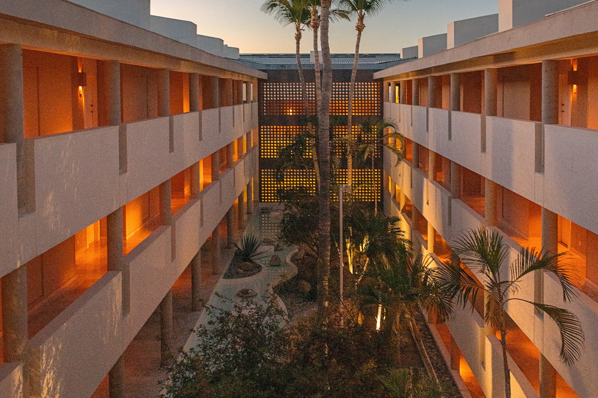 a building with many windows and trees