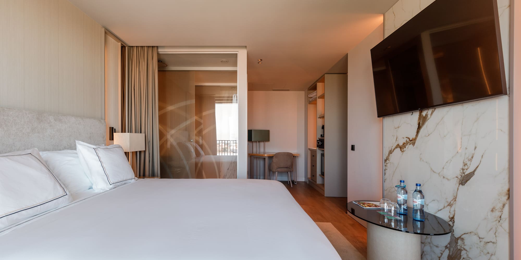 a hotel room with a bed and a table