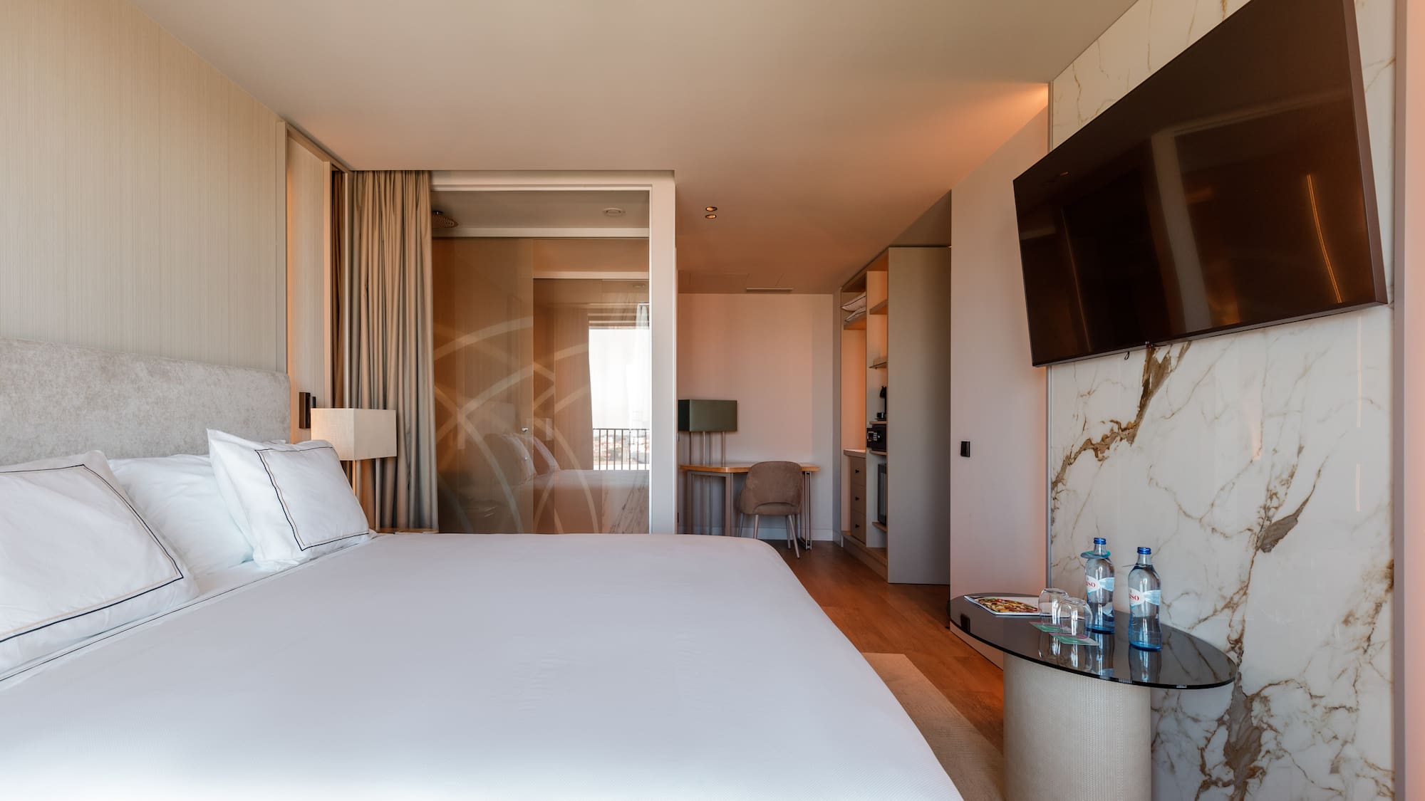 a hotel room with a bed and a table