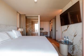 a hotel room with a bed and a table